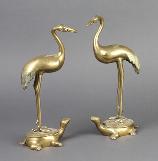 A pair of 19th Century Japanese polished bronze figures of standing storks on turtles 24cm h x 10cm w x 7cm d 