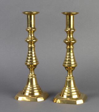 A pair of Victorian brass candlesticks with ejectors 27cm h x 10cm w x 10cm d 