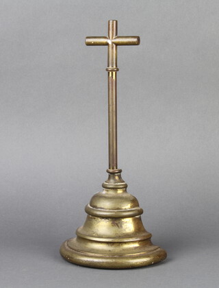 A Victorian brass door stop with cruciform handle and bell shaped base 30cm h x 14cm w x 7cm d 