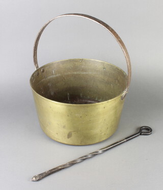 A polished brass preserving with polished steel handle 15cm x 33cm together with an iron blacksmiths made poker 46cm l

