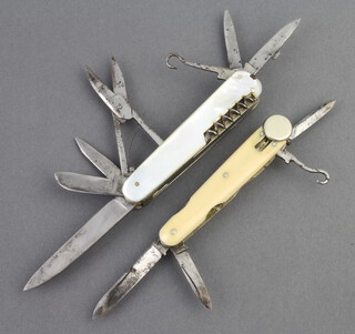Joseph West, a 19th Century multiple blade folding knife, the blade marked Joseph West with 3 blades, button hook and file with bone grip 7cm together with a multi bladed pocket knife with 5 blades, pair of scissors, corkscrew, bodkin, file and button hook with mother of pearl grip (crack to both sides) 8cm (f and r)