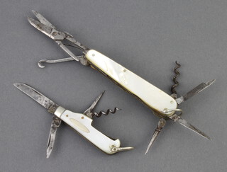 Hope Brothers, a pocket knife with 2 blades, corkscrew and bodkin with mother of pearl grip 5cm together with one other with damaged blade, scissors, button hook, 2 bodkins, corkscrew, file and pair of tweezers with 7.5cm mother of pearl grip (damage to grip) 