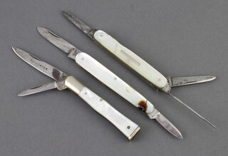 A 19th Century twin bladed penknife marked No.55, the blades marked No.55 Solinger with mother of pearl grip 7cm, a J Nicholson & Sons multi bladed folding knife with 2 blades and bodkin the 7cm mother of pearl grip f and r, together with 1 other twin bladed folding knife marked Sheffield England with mother of pearl grip 7.5cm (f and r)