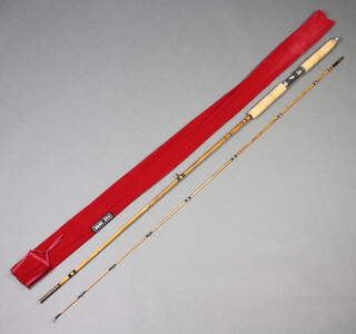 M J Kenny, a handbuilt 10', 2 piece split cane Avon fishing rod in red cloth bag 
