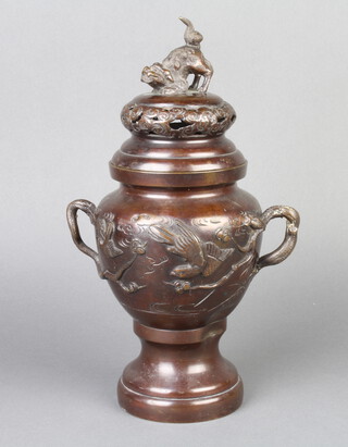 A 19th Century Japanese bronze and enamelled urn and cover with dog of fo finial, decorated birds 28cm h x 13cm  