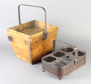 A 19th/20th Century rectangular pine and metal bound house keeper's basket with swing handle 22cm x 25cm x 30cm together with a pressed metal 6 bottle carrier with swing handle and panelled supports 9.5cm h x 19cm w x 29cm d 