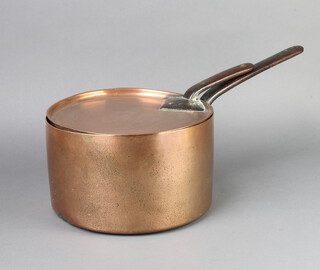 A 19th Century copper saucepan with polished steel handle 17cm x 28cm 