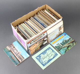 A quantity of coloured postcards