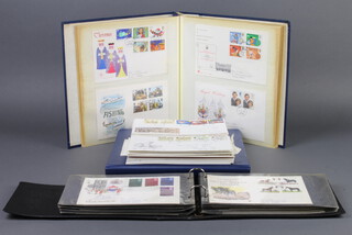 Three albums of Elizabeth II GB first day covers together with loose first day covers