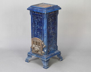 Lux, a French Art Nouveau style and green enamelled solid fuel stove raised on bracket feet 71cm h x 28cm w x 29cm d 
