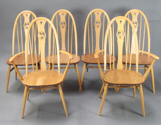 A set of 6 Ercol light elm and beech hoop back slat back dining chairs, the centre slat carved a swan, raised on turned supports with H framed stretcher 