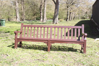 A wooden slatted bench marked Newton Driver Services Club 90cm h x 244cm w 44cm d (some splits to wood in places) 
