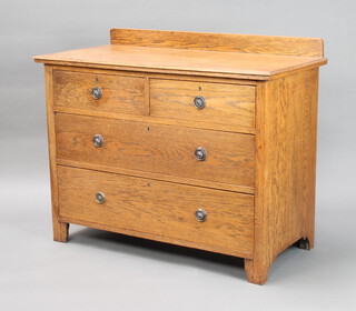 A 1930's oak chest with raised back, 2 short and 2 long drawers 81cm h x 99cm w x 48cm d 