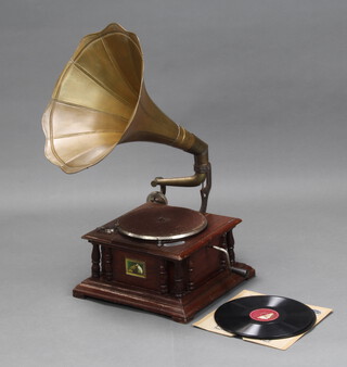 A reproduction His Master's Voice brass horned gramophone together with a collection of records, overall height 71cm x 36cm w x 37cm d 