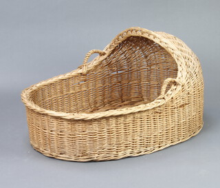 A wicker twin handled Moses basket 44cm x 60cm x 88cm 