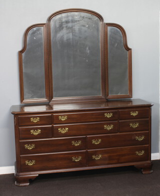 Ethan Allen, an American Philadelphia style dressing chest with arched triple plate mirror over, the base fitted 4 short and 6 long drawers, raised on ogee bracket feet 205cm h x 168cm w x 53cm d