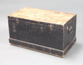 A Victorian rectangular pine trunk with hinged lid and iron drop handles 47cm h x 92cm w x 49cm d 