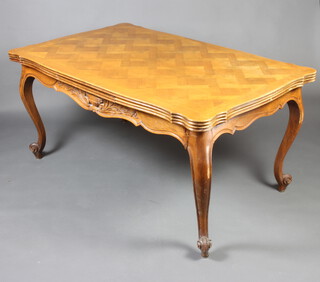 A French style walnut parquetry tile finished draw leaf dining table with carved apron, raised on carved cabriole supports 76cm h x 159cm l x 101cm w (legs f and r)