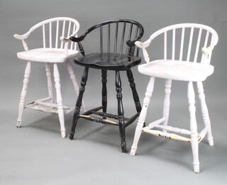 Three painted stick and rail back stools on turned supports (two white, one black)  