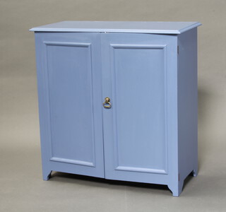 A blue painted shoe cabinet enclosed by panelled doors on bracket feet 77cm h x 76cm w x 36cm d 