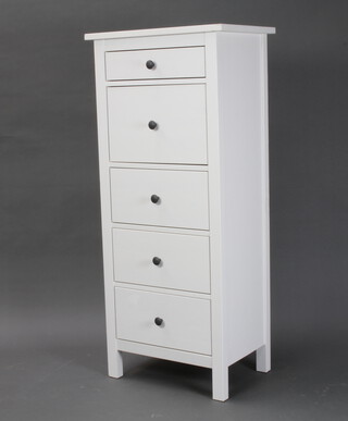 A white painted pedestal chest of 5 drawers raised on square supports 130cm h x 57cm w x 39cm d 