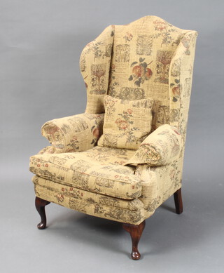 A Georgian style winged armchair upholstered in tapestry style material 117cm h x 79cm w x 62cm d (inside seat measurement 48cm x 57cm) 