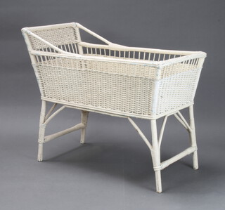 A 1950's white painted and wicker rectangular crib 80cm h x 89cm l x 47cm d 