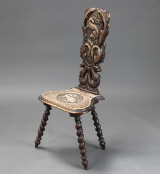 A Victorian carved oak spinning chair on spiral turned supports, carved a dragon 90cm h x 39cm w x 30cm d (pitting to the back, split to the seat and some sun damage) 