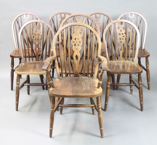 A set of 8 beech framed stick and wheel back dining chairs - 2 carvers, 6 standard