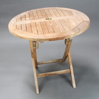 A circular slatted hardwood folding garden table 80cm diam.