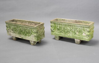 A pair of rectangular reconstituted stone plant troughs with swag and mask decoration 25cm h x 72cm w x 23cm d  