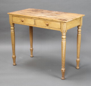 A Victorian pine side table fitted 2 drawers, on turned supports 74cm h x 91cm w x 46cm d (some pitting and staining to the top)
