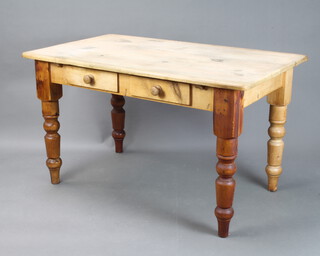 A Victorian rectangular pine table fitted 2 frieze drawers, on turned supports 76cm h x 132cm l x 78cm w