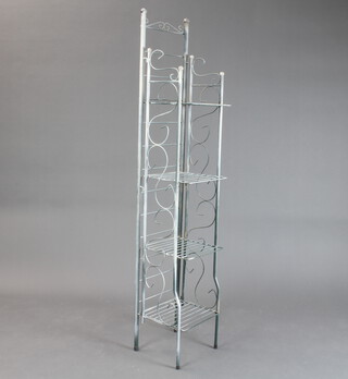 A tubular metal 4 tier folding bookcase/display stand 37cm h x 28cm w x 28cm d 