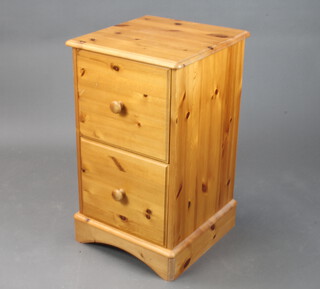 A pine 2 drawer filing cabinet with tore handles on bun feet 76cm h x 44cm w x 45cm d (slight scratches to the top)