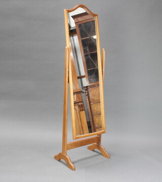 An arch plate cheval mirror contained in a beech finished frame 147cm h x 45cm w x 33cm 