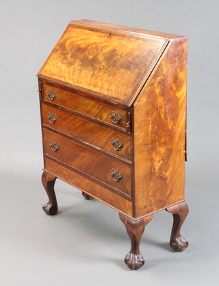 A 1930's walnut Queen Anne style bureau with fall front above 3 long graduated drawers, on cabriole ball and claw supports 92cm h x 69cm w x 30cm d 