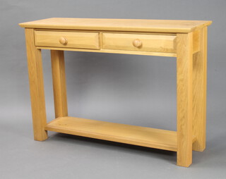 A rectangular light oak side table/dresser base fitted 2 drawers with tore handles on square supports with undertier 83cm h x 120cm w x 38cm d (some water marks to the top) 
