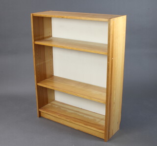 A pair of pine bookcases fitted adjustable shelves 107cm h x 80cm w x 28cm d 