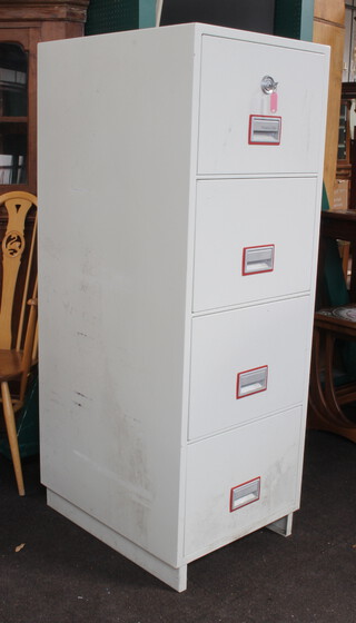 A Phoenix 2244 four drawer fire resistant filing cabinet 149cm h x 53cm w x 67cm d complete with key 
