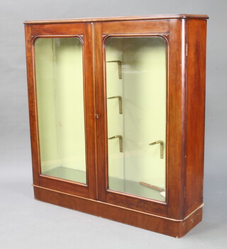 A Victorian mahogany D shaped display cabinet with glazed shelves, raised on a platform base (formerly the top of a bookcase) 125cm h x 118cm w x 32cm d 