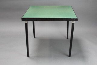 An ebonised folding bridge table with green baise top 65cm h x 76cm w x 76cm d 