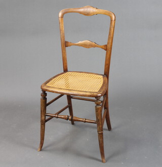 A Victorian mahogany ladder back bedroom chair with woven cane seat