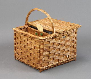 An Antler wicker picnic basket containing 6 Duralex glasses, 6 tea plates, cheese knife, pastry forks etc 28cm h x 38cm w x 37cm d 
