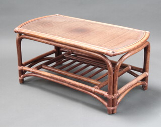 An oval bamboo 2 tier coffee table with plate glass top 46cm h x 102cm x 51cm 
