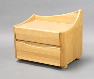 A mid Century elm chest with raised shaped 3/4 gallery fitted 2 drawers raised on bun feet 54cm h x 59cm w x 41cm d