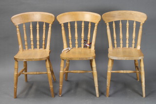 A set of 3 pine stick and rail back Windsor dining chairs 