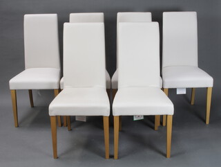 A set of 6 Italian beech framed dining chairs, the seats and backs upholstered in white leather  