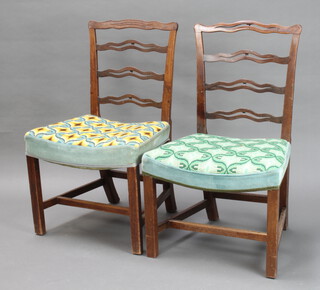 A pair of 19th Century mahogany London ladder back dining chairs with over stuffed seats, on square supports 