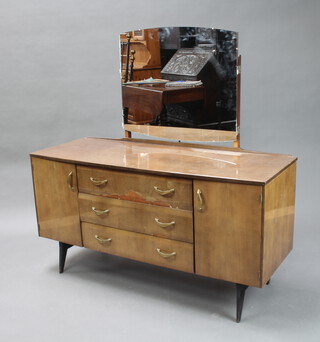 A mid Century Merrydew style laminate finished dressing chest with triple mirror above 3 drawers flanked by cupboards 125cm h x 128cm w x 48cm d, together with a Merrydew matching headboard 87cm h x 122cm w 